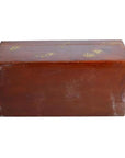 Brown lacquered rectangular box with gold floral painted lid, minor scratches, placed on a plain background.
