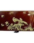 Brown lacquered Chinese dowry box with gold hand-painted birds, flowers, and bamboo on surface.