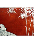 Red lacquered box with white bird and bamboo branch design, hand painted, on a vintage Chinese dowry box.