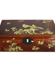 Black and gold lacquered wooden dowry box with hand painted bird and floral designs, close-up of decorative latch.
