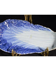 Blue and white porcelain dish, vintage Chinese, lettuce leaf-shaped, hand-painted, on metal display stand.