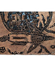 Vintage copper Batek ink block with engraved rocket, stars, planets, and house on a cosmic-themed background.