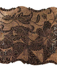 Close-up of vintage copper Batek ink block with engraved intricate floral and leaf patterns.