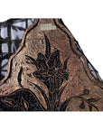 Close-up of vintage copper Batek ink block with intricate black and gold floral pattern on mesh.
