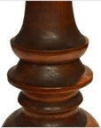 Close-up of dark brown polished wood candle holder, hand carved with Dutch influence and smooth curved details.