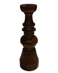 Close-up of a dark brown hand-carved wooden candle holder with vintage Dutch style on a white background.