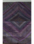 Purple silk fabric with purple, silver, and gold embroidery in intricate decorative patterns, close-up.