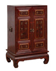 Red Negora lacquer and metal Japanese display cabinet with gilded calligraphy, shown indoors.