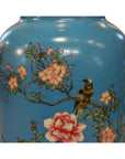 White porcelain vase with gold side handles, hand painted pink flowers, and bird on branch, close-up view.