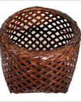 Brown rattan woven basket with open top and crisscross lattice design, vintage Thai style, close-up view.