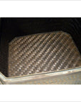Close-up of a brown woven rattan basket with textured pattern and square bottom.