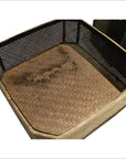 Brown woven rattan basket with mesh sides and herringbone base, top view.