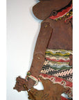 Close-up of colorful cowhide Wayang Kulit shadow puppet arm and costume, antique Balinese Indonesian style.
