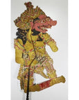 Colorful Balinese cowhide Wayang Kulit shadow puppet with ornate costume and exaggerated features on white background.