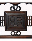 Dark brown Yumu wood Chinese chair with hand-carved décor and lacquered finish, shown against a neutral background.