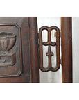 Dark brown Yumu wood Chinese chair with hand-carved décor and lacquered finish, shown against a neutral background.