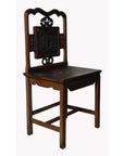 Dark brown Yumu wood Chinese chair with hand-carved décor and lacquered finish, shown against a neutral background.