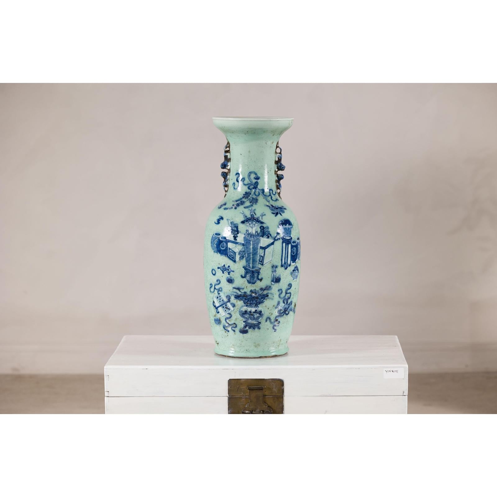 Cobalt blue and white porcelain vase with scholar images on a white chest, plain background, 19th century.