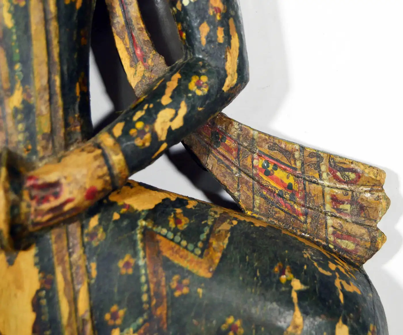 Decorative object with intricate patterns and colors on a white background