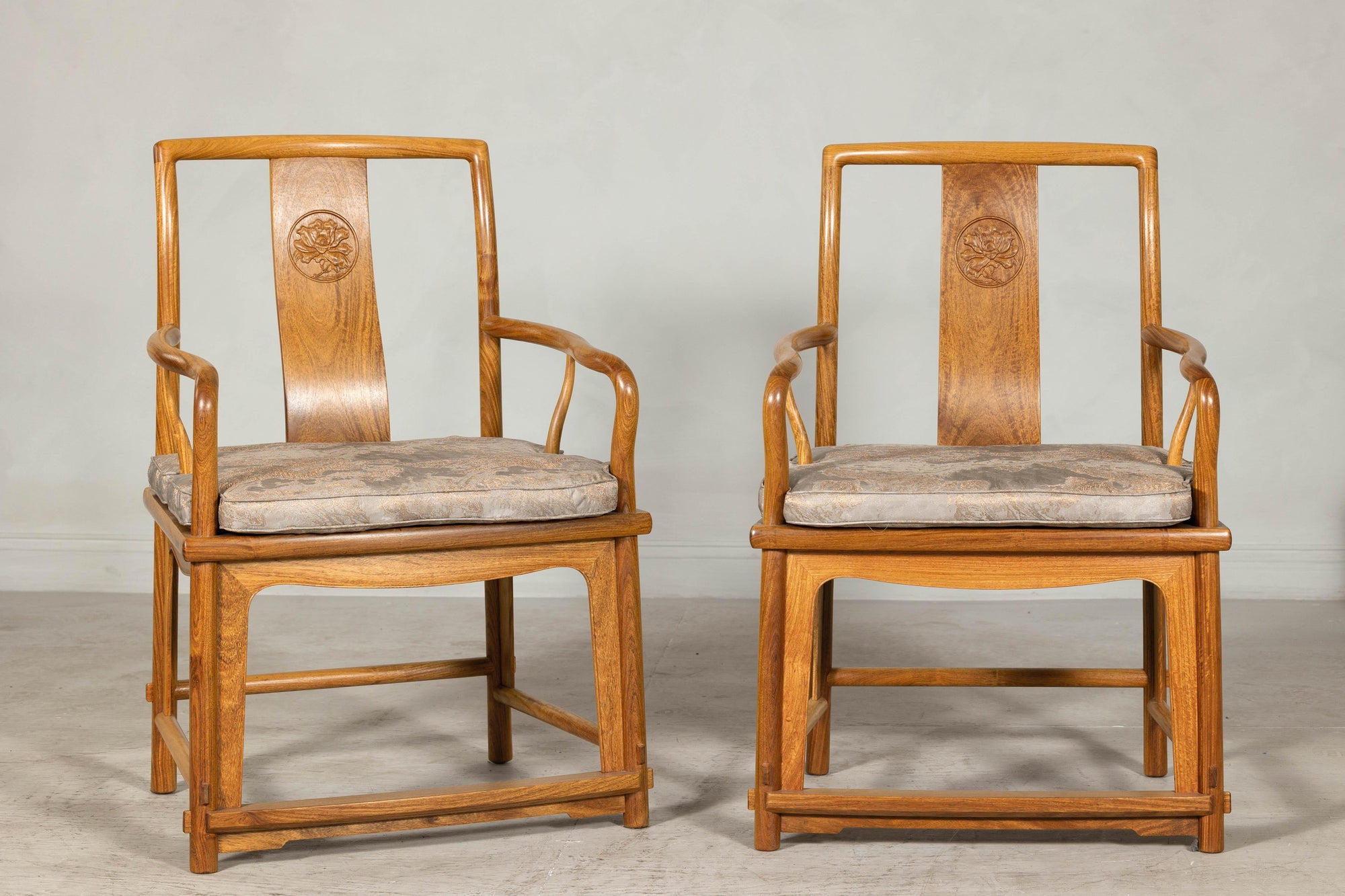 Pair of Ming-Style Hardwood Armchairs with Carved Medallion and Cushions