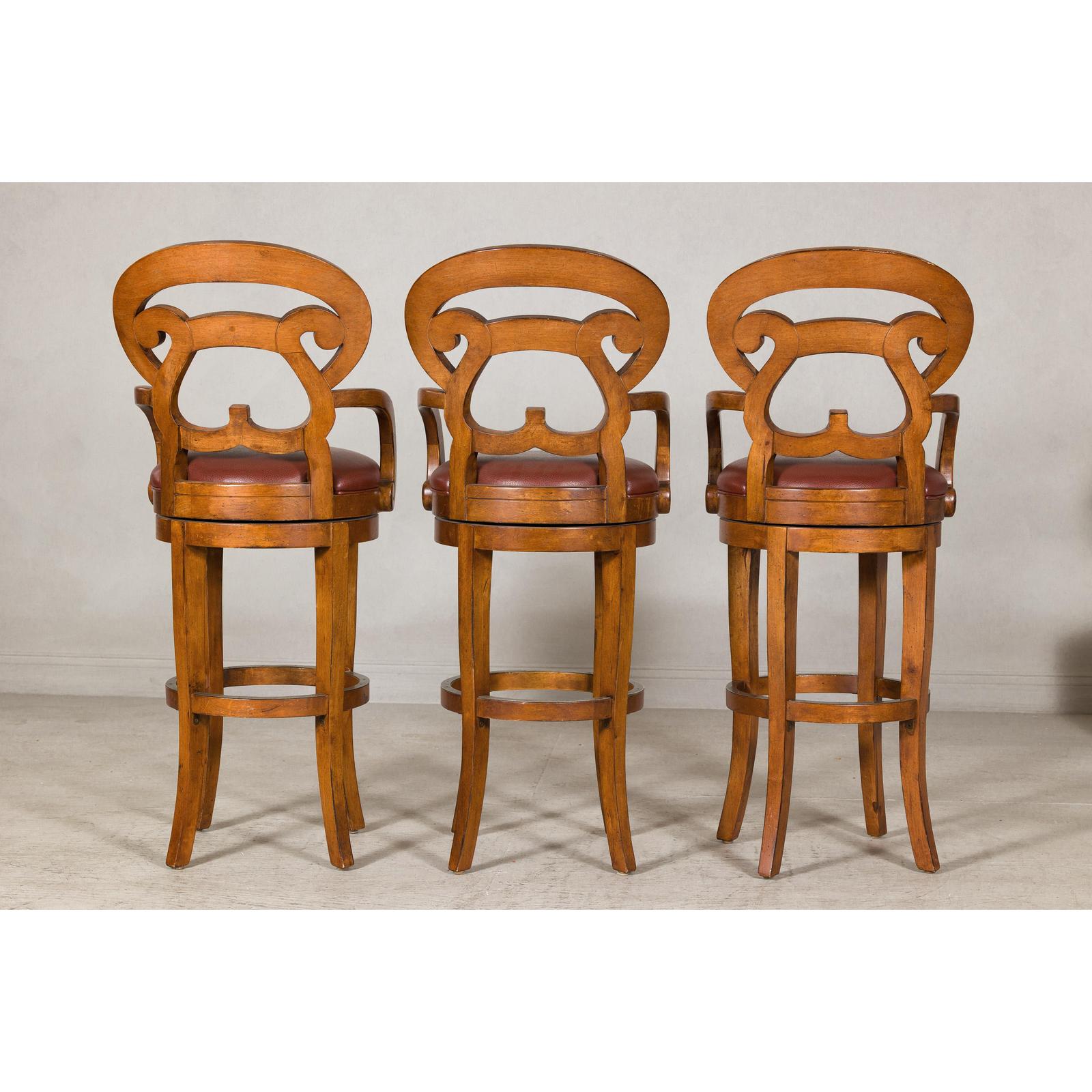 Swivel Bar Stools with Carved Backs and Faux Leather Seats – Set of Three