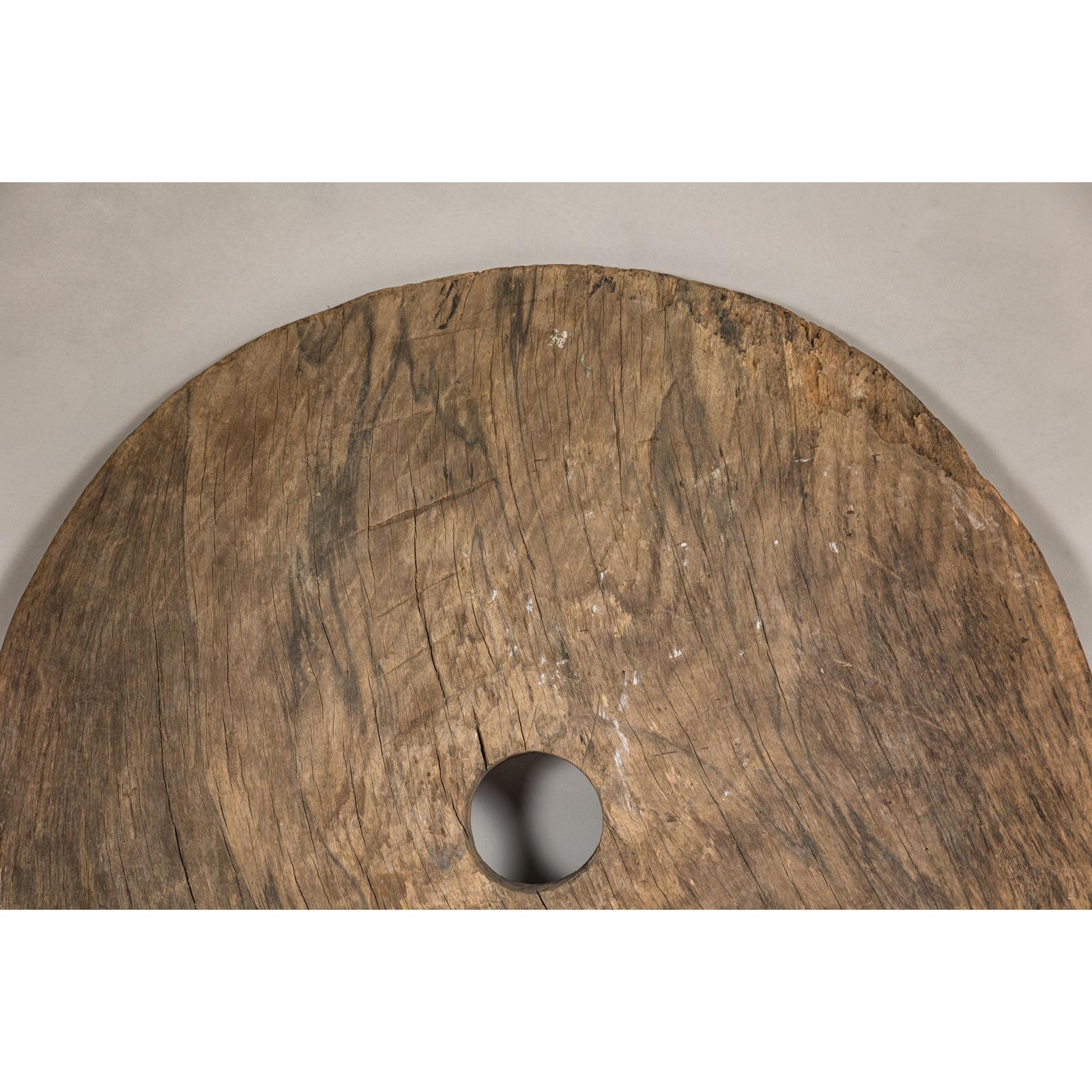 Large Ancient Cart Wheel with Rustic Character and Time-Worn Appearance