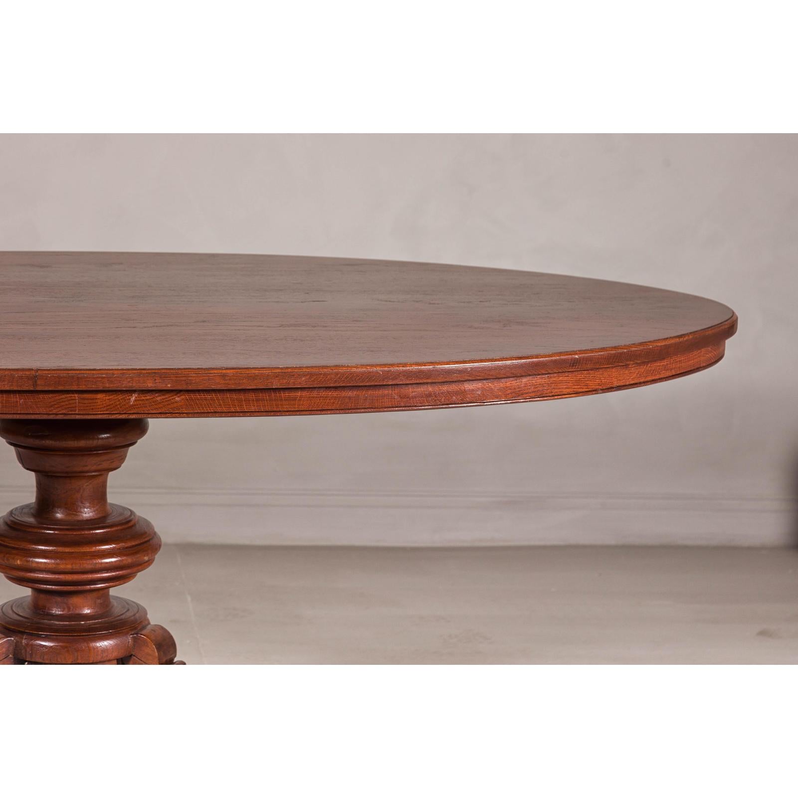 Dutch Colonial Oval Pedestal Dining Table with Scrolling Base, Late 19th Century