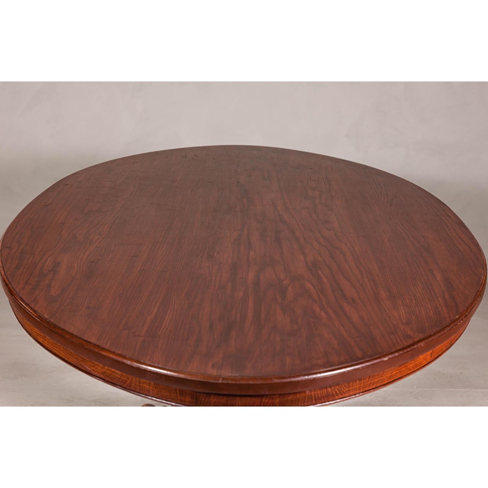 Dutch Colonial Oval Pedestal Dining Table with Scrolling Base, Late 19th Century