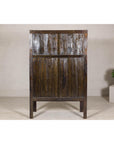 Late Qing Dynasty Black Lacquer Elm Cabinet with Gilt Motifs and Carved Apron