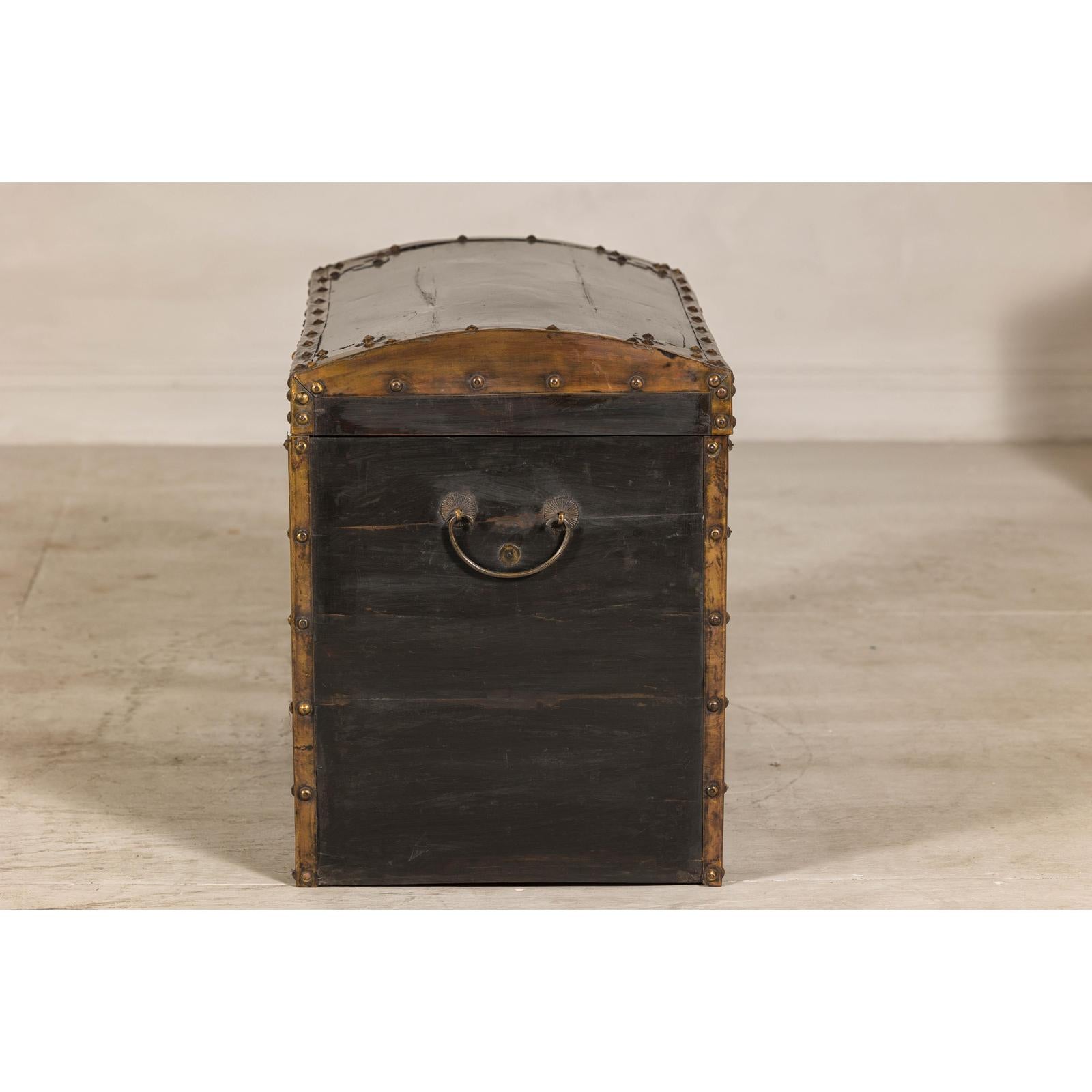 Antique Black and Gold Late Qing Dynasty Trunk with Curved Top and Brass Accents