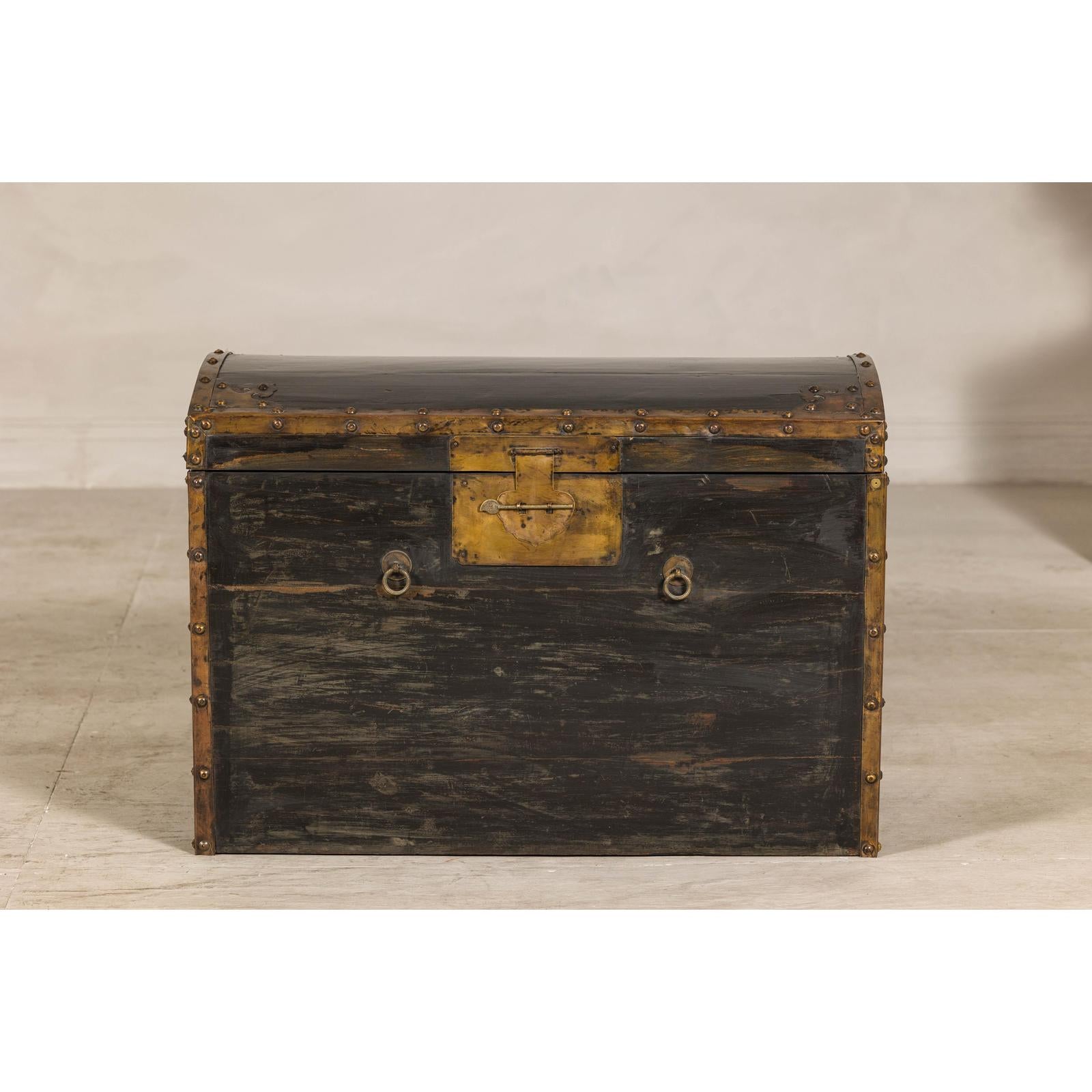 Antique Black and Gold Late Qing Dynasty Trunk with Curved Top and Brass Accents