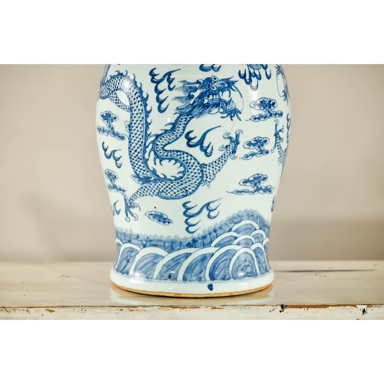 Qing Dynasty Blue and White Porcelain Dragon Jar with Lid and Foo Dog Finial