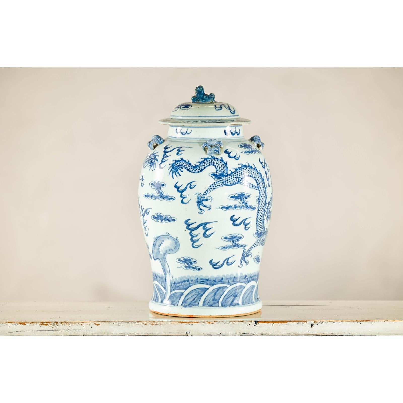 Qing Dynasty Blue and White Porcelain Dragon Jar with Lid and Foo Dog Finial