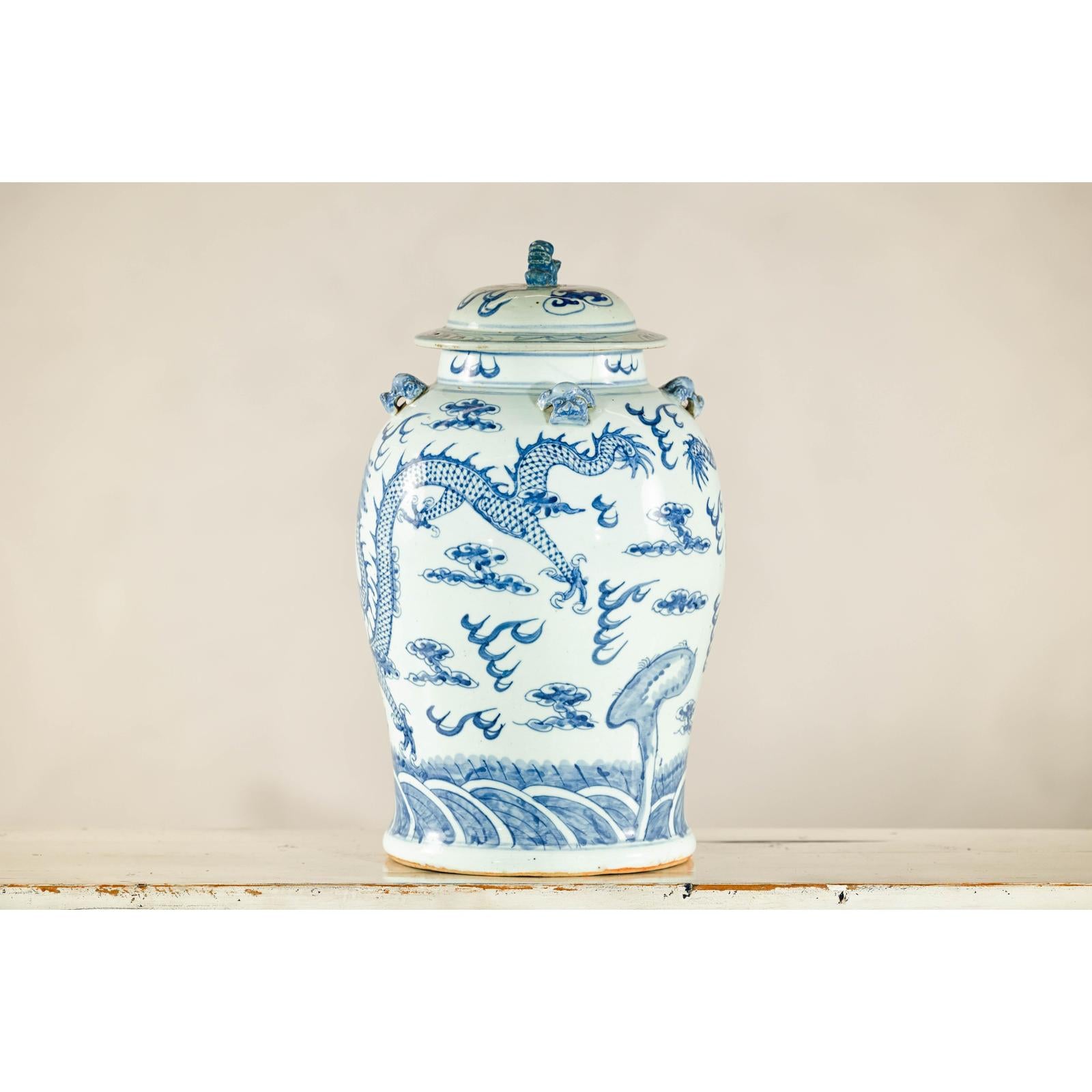 Qing Dynasty Blue and White Porcelain Dragon Jar with Lid and Foo Dog Finial