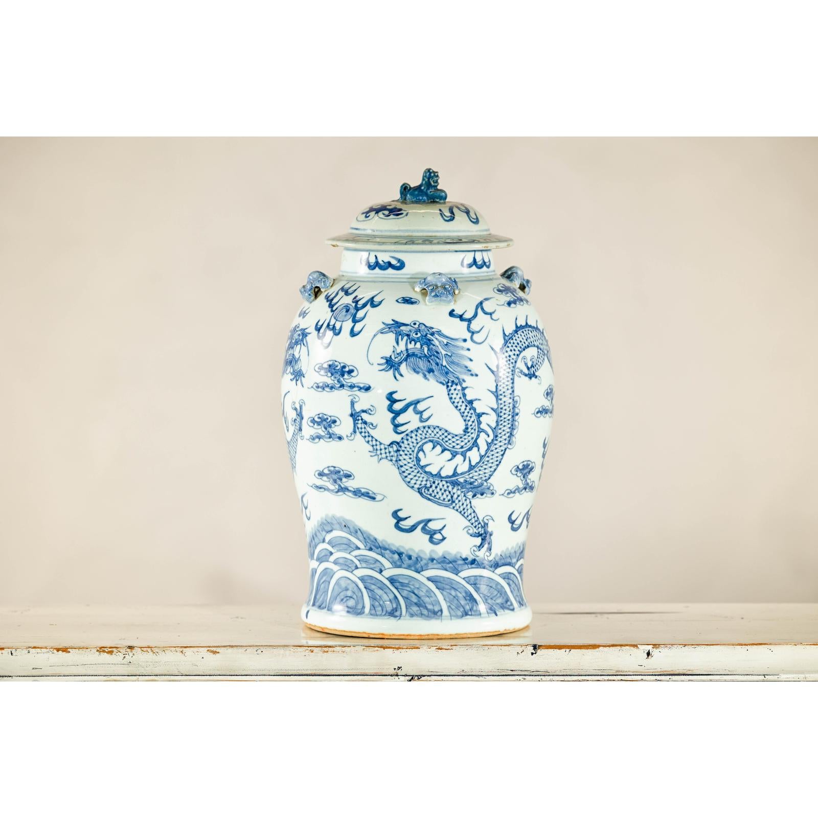 Qing Dynasty Blue and White Porcelain Dragon Jar with Lid and Foo Dog Finial