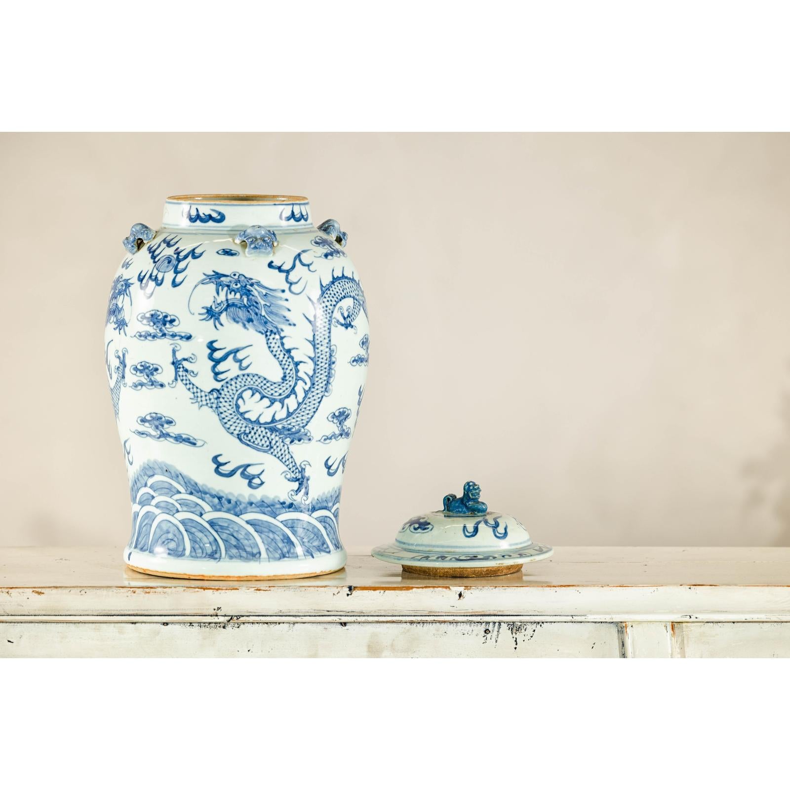 Qing Dynasty Blue and White Porcelain Dragon Jar with Lid and Foo Dog Finial