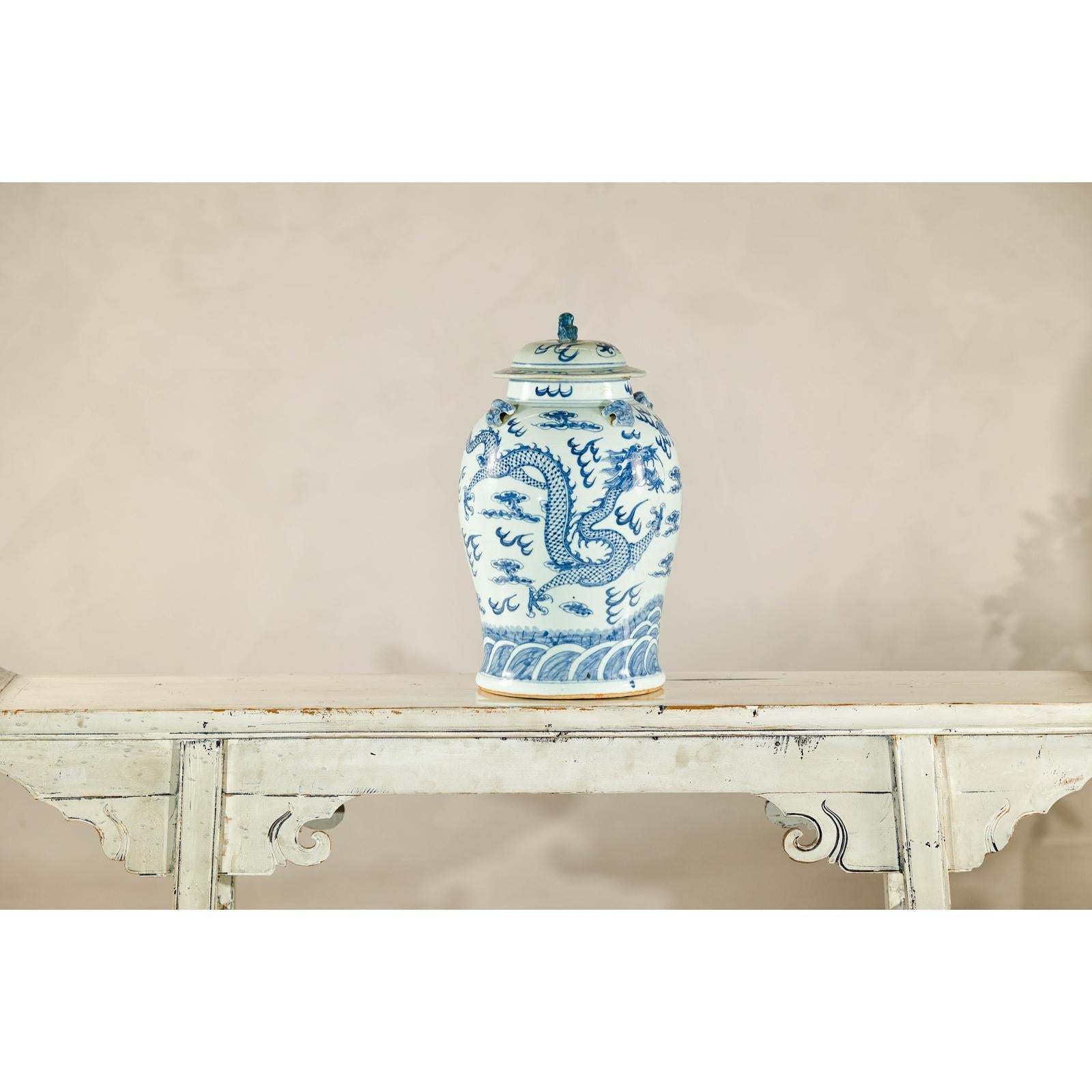 Qing Dynasty Blue and White Porcelain Dragon Jar with Lid and Foo Dog Finial