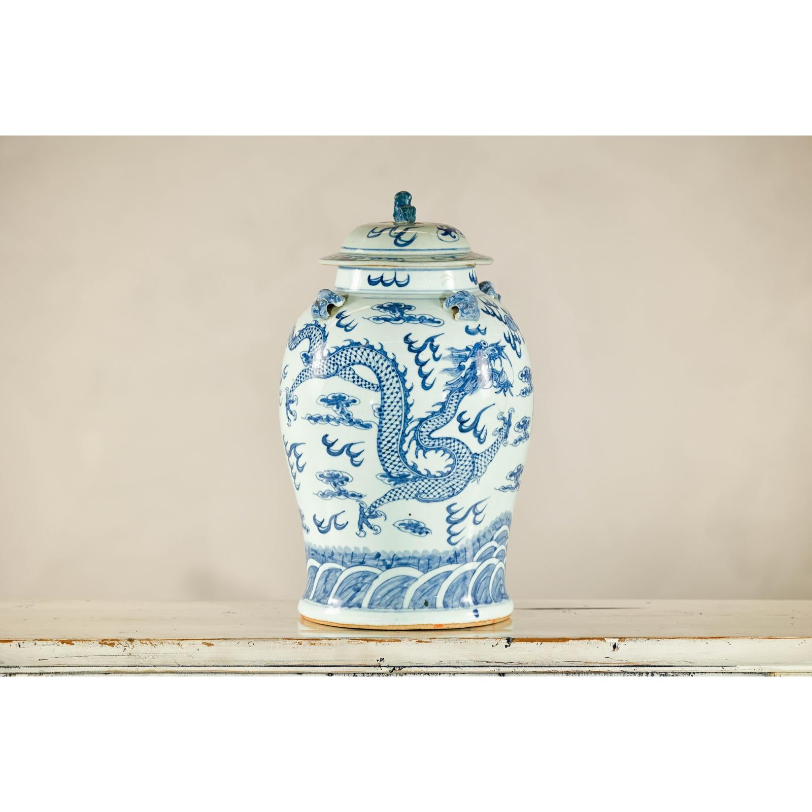 Qing Dynasty Blue and White Porcelain Dragon Jar with Lid and Foo Dog Finial