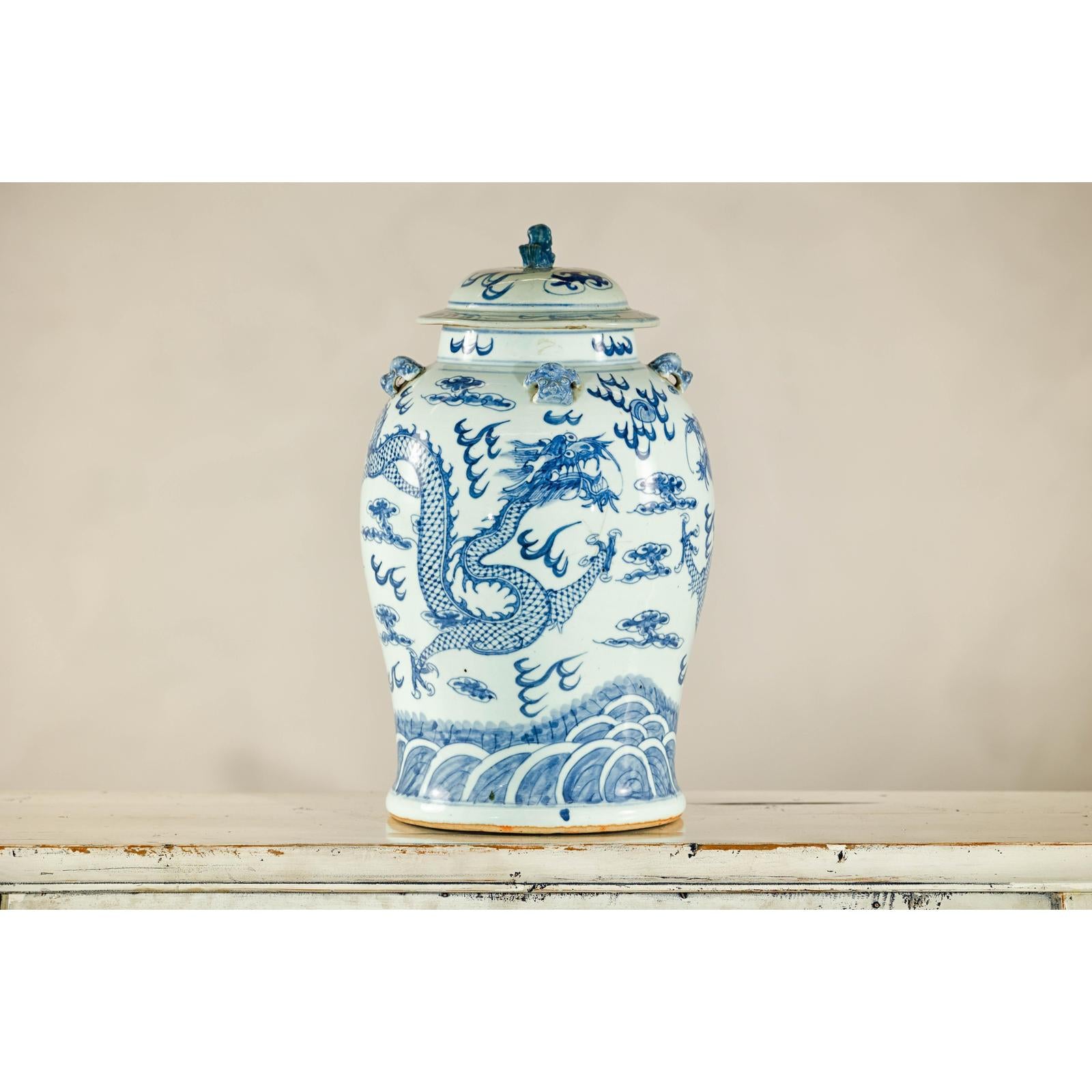 Qing Dynasty Blue and White Porcelain Dragon Jar with Lid and Foo Dog Finial