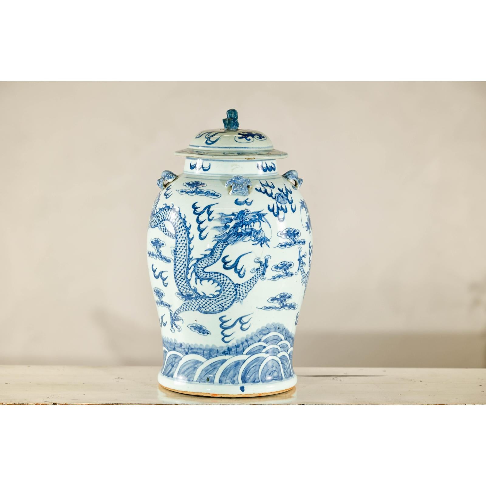 Qing Dynasty Blue and White Porcelain Dragon Jar with Lid and Foo Dog Finial