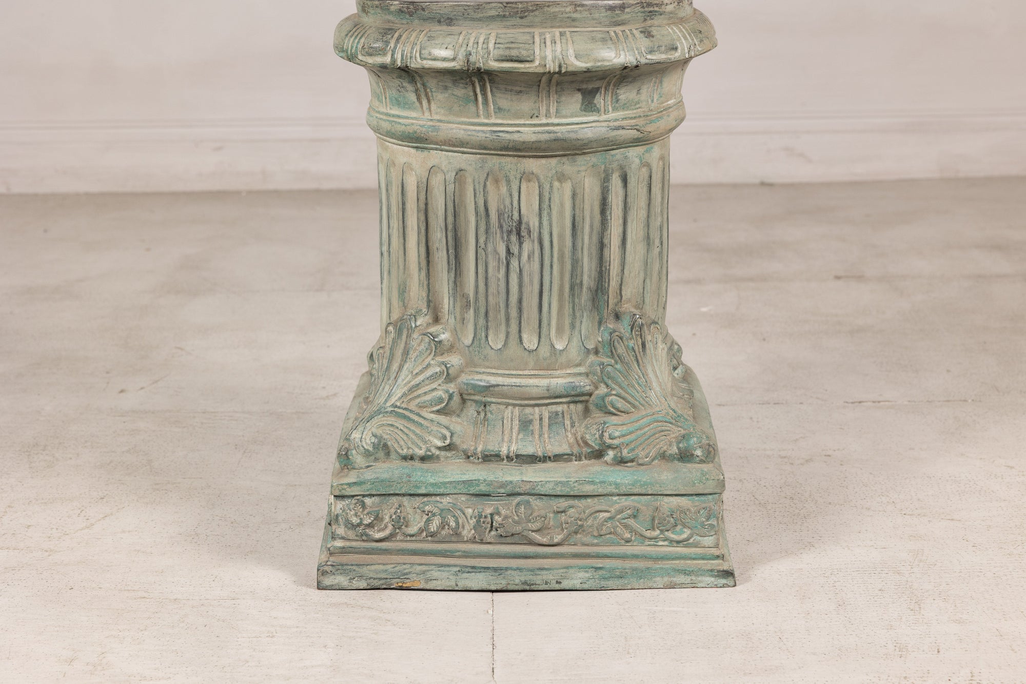Verdigris bronze pedestal with fluted column and square base, front view