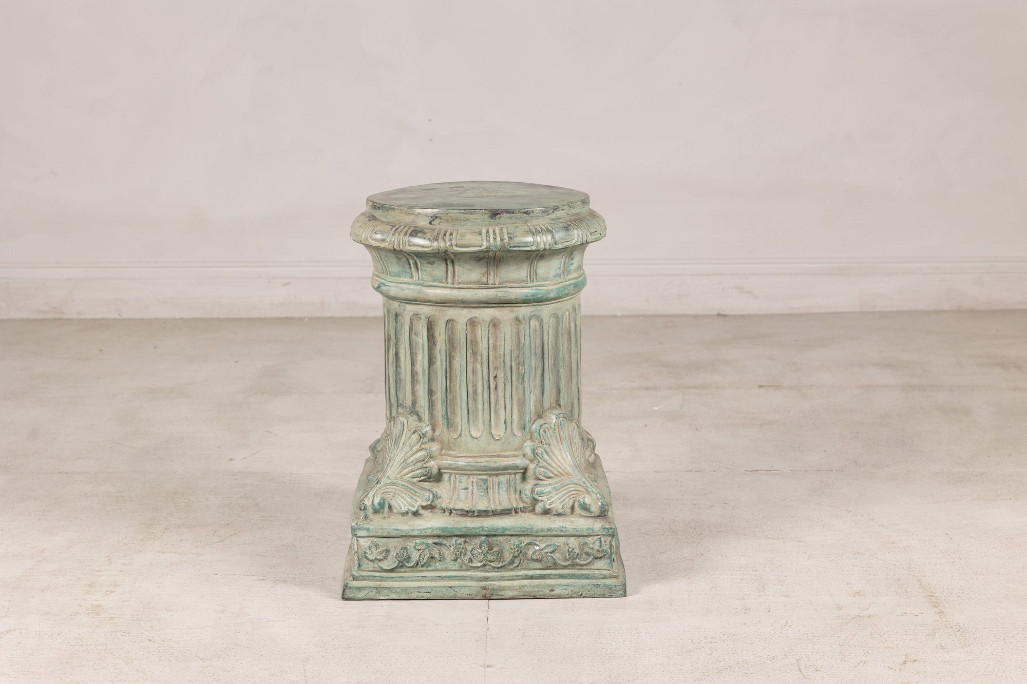 Verdigris bronze pedestal, distant front view