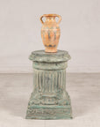 Verdigris bronze pedestal styled with a ceramic vase