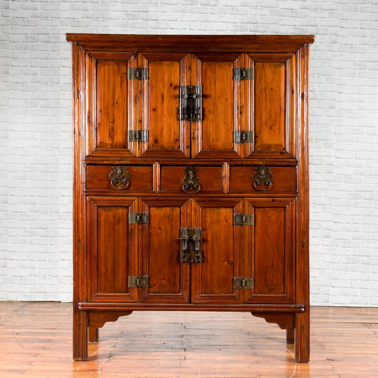 Wooden cabinet with multiple doors on a white background