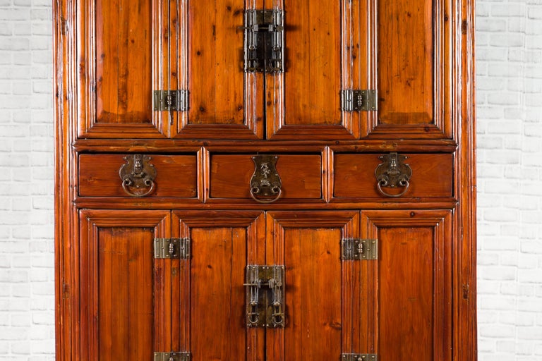 Wooden cabinet with multiple doors on a white background