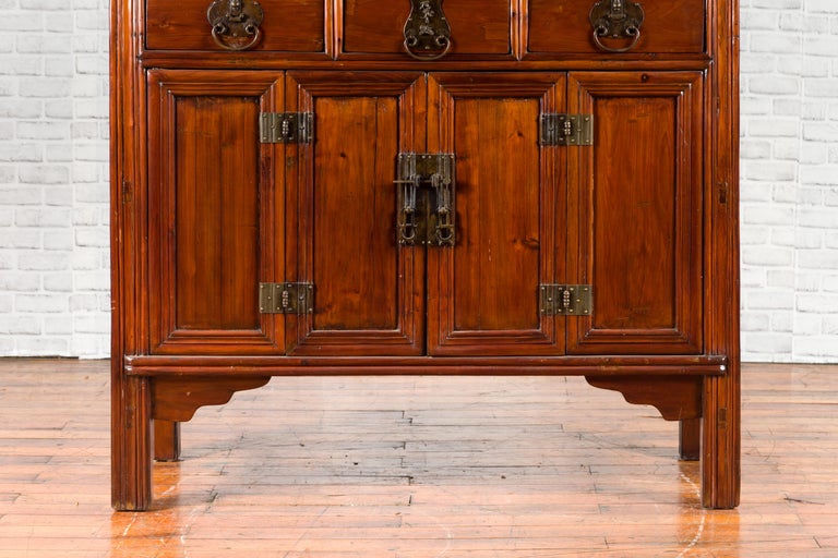Wooden cabinet with multiple doors on a white background