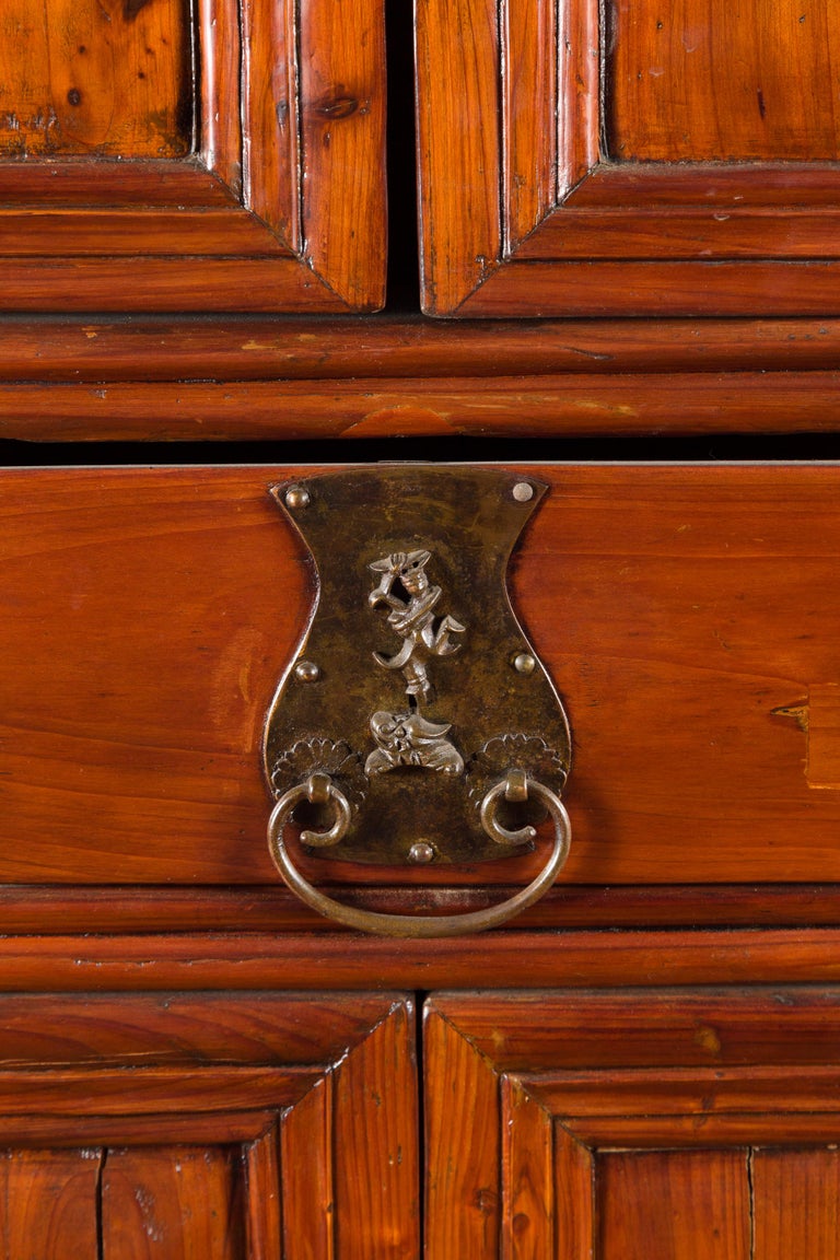 Wooden cabinet with multiple doors on a white background