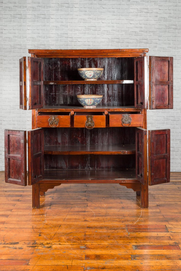 Wooden cabinet with multiple doors on a white background
