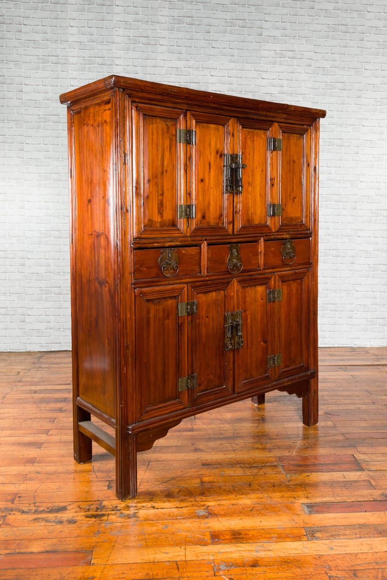 Wooden cabinet with multiple doors on a white background
