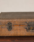 Close-up of rattan trunk front and dark iron hardware